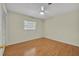 Well-lit bedroom with wood flooring and a ceiling fan at 2231 Deloraine Trl, Maitland, FL 32751