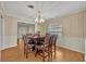 Formal dining room with wood table and six chairs at 2231 Deloraine Trl, Maitland, FL 32751