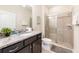 Bathroom with granite countertop and walk-in shower at 2432 Dubai St, Kissimmee, FL 34747