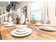 Modern dining table setting with place settings for eight at 2432 Dubai St, Kissimmee, FL 34747