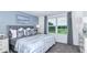 Bedroom with gray headboard and serene decor at 2488 Penguin Blvd, Davenport, FL 33837