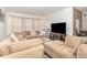 Relaxing living room with sectional sofa and a fireplace at 250 Merry Brook Cir, Sanford, FL 32771