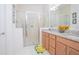 Elegant bathroom with double vanity, granite countertop, and large shower at 2555 Yellow Brick Rd, St Cloud, FL 34772