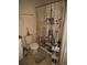 Clean bathroom with a shower/tub and decorative shower curtain at 2624 Robert Trent Jones Dr # 615, Orlando, FL 32835