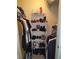 Well-organized closet with shelving and hanging space at 2624 Robert Trent Jones Dr # 615, Orlando, FL 32835