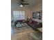 Bright living room with comfortable seating and large windows at 2624 Robert Trent Jones Dr # 615, Orlando, FL 32835