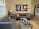 Living room with gray sofas and coffee table at 2624 Robert Trent Jones Dr # 615, Orlando, FL 32835