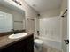 Clean bathroom with shower/tub combo and granite vanity at 2650 Sw 162Nd Ln, Ocala, FL 34473