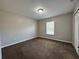 Spacious bedroom with brown carpet and neutral walls at 2650 Sw 162Nd Ln, Ocala, FL 34473