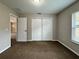 Bright bedroom with double door closet and carpet flooring at 2650 Sw 162Nd Ln, Ocala, FL 34473