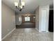 Dining area with tile floors and a chandelier at 2650 Sw 162Nd Ln, Ocala, FL 34473