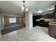 Kitchen with dark brown cabinets and tile flooring at 2650 Sw 162Nd Ln, Ocala, FL 34473