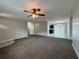 Spacious living room with ceiling fan and access to other rooms at 2650 Sw 162Nd Ln, Ocala, FL 34473