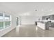 Spacious living room with tile floors and lots of natural light from large windows at 2664 Hancock Crossing Dr, Bartow, FL 33830