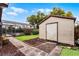 A shed and screened-in lanai offer a backyard oasis with a lush lawn and potential for outdoor living at 2717 Rose Moss Ln, Orlando, FL 32807