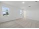 Bright, spacious bedroom with large windows, neutral carpet, and fresh white paint at 27469 Black Kite Ave, Howey In The Hills, FL 34737