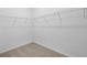 Spacious walk-in closet offering ample storage with wire shelving; well-organized and functional at 27469 Black Kite Ave, Howey In The Hills, FL 34737