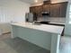 Spacious kitchen featuring a large center island, perfect for entertaining guests at 27469 Black Kite Ave, Howey In The Hills, FL 34737