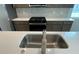 The kitchen showcases quartz countertops, gas range, and stainless steel appliances at 27469 Black Kite Ave, Howey In The Hills, FL 34737