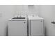 Functional laundry room featuring a modern washer and dryer set for convenient chores at 27469 Black Kite Ave, Howey In The Hills, FL 34737