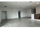 Open-concept living space with tile flooring and ample natural light at 27469 Black Kite Ave, Howey In The Hills, FL 34737