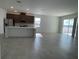 Bright and airy living space connects seamlessly with the modern kitchen at 27469 Black Kite Ave, Howey In The Hills, FL 34737
