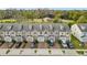 Row of townhouses viewed from above showcasing the community layout and landscaping at 3196 Crown Jewel Ct, Winter Park, FL 32792