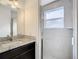 Bathroom with granite countertop, single sink and shower at 3196 Crown Jewel Ct, Winter Park, FL 32792