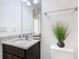 Bathroom featuring granite countertop and dark brown vanity at 3196 Crown Jewel Ct, Winter Park, FL 32792