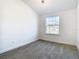 Bright bedroom with window and carpet flooring at 3196 Crown Jewel Ct, Winter Park, FL 32792