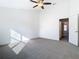 Bright bedroom featuring carpet, ceiling fan and large window at 3196 Crown Jewel Ct, Winter Park, FL 32792