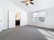 Bright bedroom with carpet flooring and ensuite bathroom access at 3196 Crown Jewel Ct, Winter Park, FL 32792