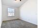 Spacious bedroom with window and carpet flooring at 3196 Crown Jewel Ct, Winter Park, FL 32792