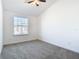 Spacious bedroom with a window and carpet flooring at 3196 Crown Jewel Ct, Winter Park, FL 32792