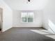 Well lit bedroom with carpet flooring and large window at 3196 Crown Jewel Ct, Winter Park, FL 32792