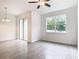 Bright dining room features tile floors and sliding glass doors leading to the backyard at 3196 Crown Jewel Ct, Winter Park, FL 32792