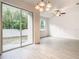 Bright dining area with tile floors and sliding glass doors at 3196 Crown Jewel Ct, Winter Park, FL 32792