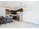 Modern kitchen with dark cabinetry and granite countertops at 3196 Crown Jewel Ct, Winter Park, FL 32792