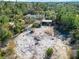 Aerial view of property showing house, shed, and cleared land at 3290 Red Fox Dr, Deltona, FL 32725