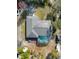 Aerial view of house with solar panels and screened pool at 3290 Red Fox Dr, Deltona, FL 32725