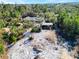 Aerial view of property showing house, shed, and cleared land at 3290 Red Fox Dr, Deltona, FL 32725