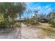 Landscaped backyard with a stone path at 3290 Red Fox Dr, Deltona, FL 32725