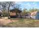 Rustic barn with a horse stall and storage shed at 3290 Red Fox Dr, Deltona, FL 32725