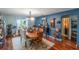 Bright dining room featuring a rustic wooden table and chairs at 3290 Red Fox Dr, Deltona, FL 32725