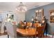 Rustic dining room, featuring a large wooden table and chandelier at 3290 Red Fox Dr, Deltona, FL 32725