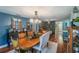 Rustic dining room with wood table and statement lighting at 3290 Red Fox Dr, Deltona, FL 32725