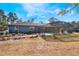 Backyard view of the home showcasing the pool and deck at 3290 Red Fox Dr, Deltona, FL 32725