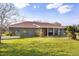 Charming single-story home featuring a cozy front porch and well-maintained lawn at 36129 E Eldorado Lake Dr, Eustis, FL 32736