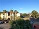 Apartment building with tennis courts and palm trees at 3700 Castle Pines Ln # 4032, Orlando, FL 32839