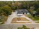 An aerial view showcasing a single-story house with a unique landscape design at 409 San Sebastian Prado, Altamonte Springs, FL 32714